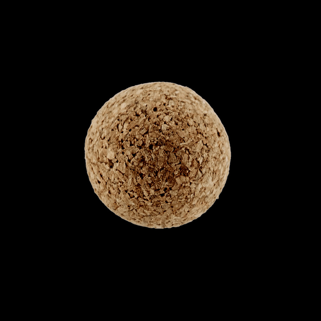 Cork sphere with a textured surface, embodying eco-friendly aesthetics.