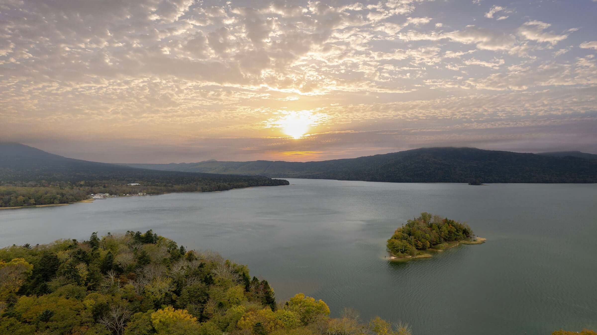 Scenic sunset over Lake Akan in Hokkaido, Japan — the natural home of the Marimo moss ball and a sacred site for Marimo conservation