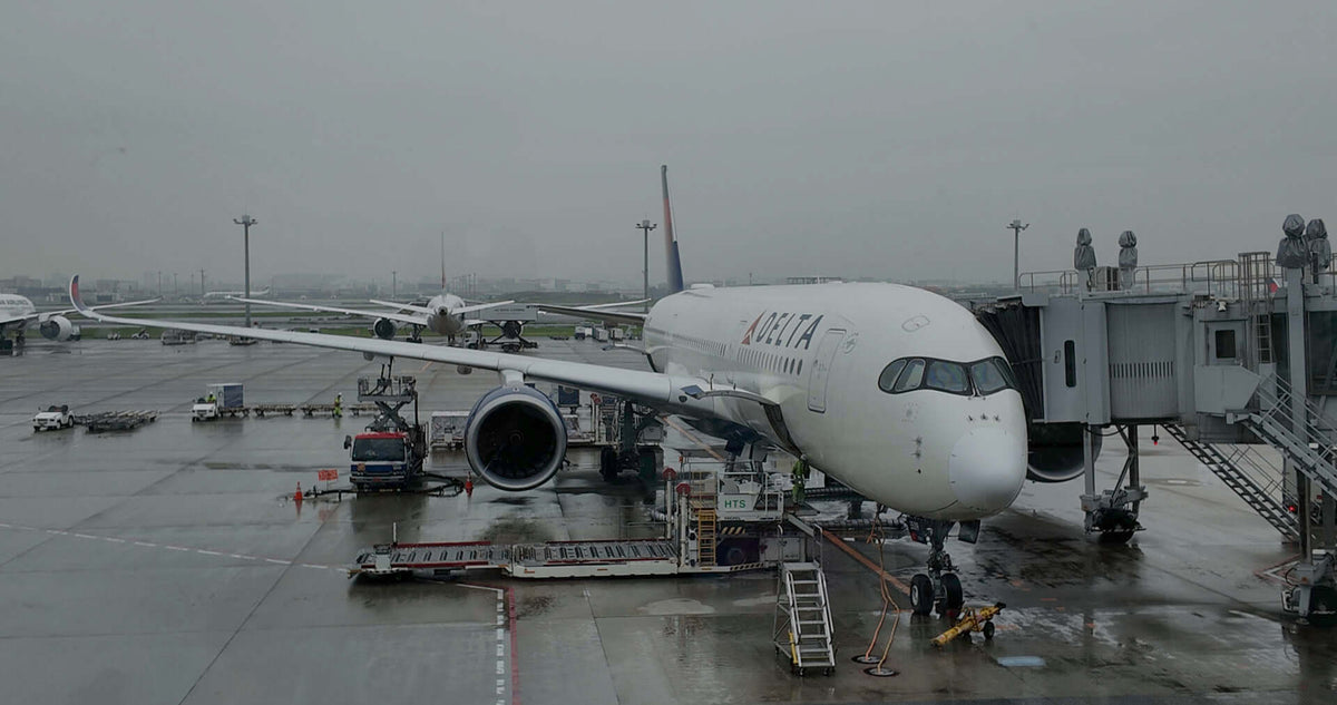 Jet Airplane being loaded with passengers and ready to take a flight to Hokkaido, Japan.
